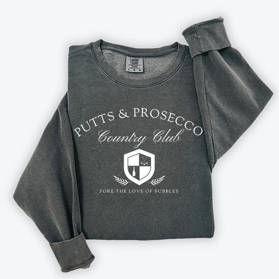 Putts and Prosecco lightweight Comfort Colors crewneck sweatshirt with vintage old-money style. Features 'Fore the Love of Bubbles' pun in an elegant design on soft cotton fabric.