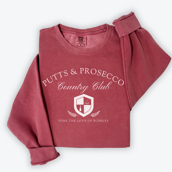 Putts and Prosecco lightweight Comfort Colors crewneck sweatshirt with vintage old-money style. Features 'Fore the Love of Bubbles' pun in an elegant design on soft cotton fabric.