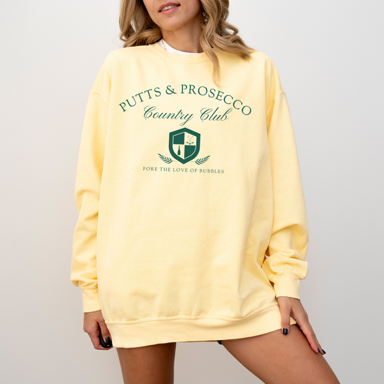 Putts and Prosecco lightweight Comfort Colors crewneck sweatshirt with vintage old-money style. Features 'Fore the Love of Bubbles' pun in an elegant design on soft cotton fabric.