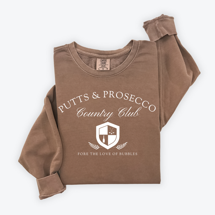 Putts and Prosecco lightweight Comfort Colors crewneck sweatshirt with vintage old-money style. Features 'Fore the Love of Bubbles' pun in an elegant design on soft cotton fabric.