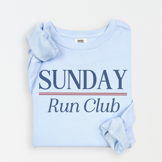 Sunday Run Club Comfort Colors lightweight crewneck sweatshirt with a vintage retro vibe, featuring bold red and blue print on soft cotton fabric, styled for casual or athletic wear.