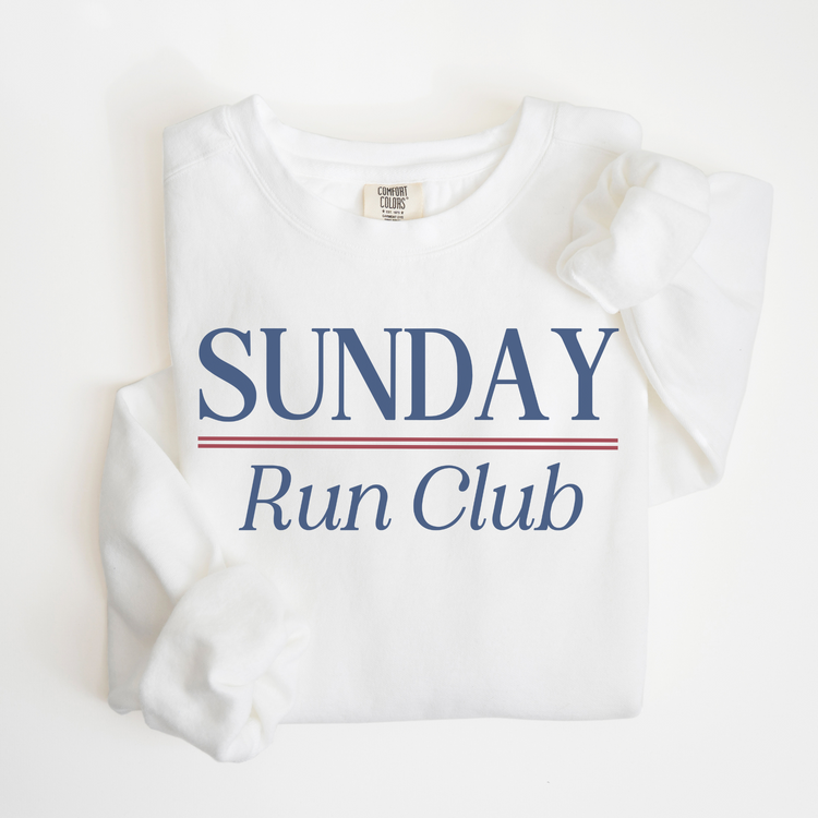 Sunday Run Club Comfort Colors lightweight crewneck sweatshirt with a vintage retro vibe, featuring bold red and blue print on soft cotton fabric, styled for casual or athletic wear.