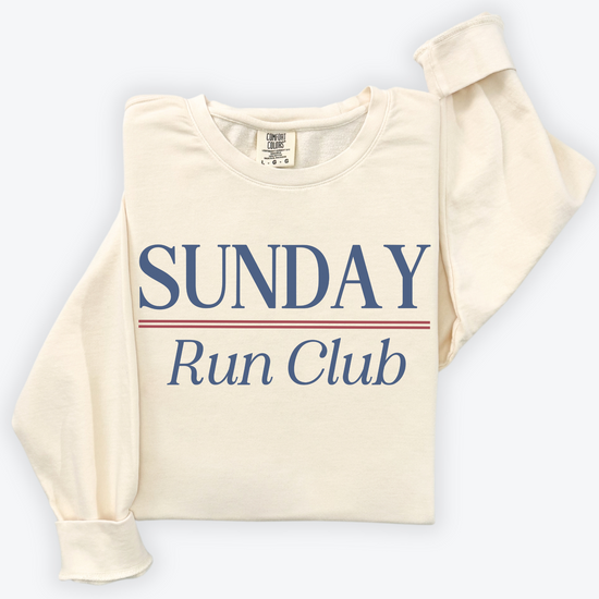 Sunday Run Club Comfort Colors lightweight crewneck sweatshirt with a vintage retro vibe, featuring bold red and blue print on soft cotton fabric, styled for casual or athletic wear.