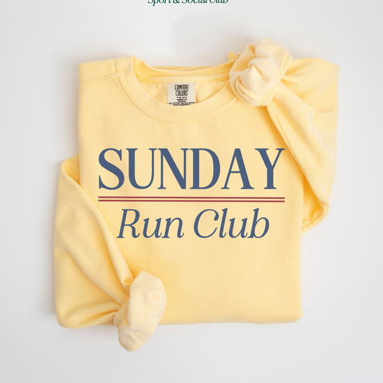 Sunday Run Club Comfort Colors lightweight crewneck sweatshirt with a vintage retro vibe, featuring bold red and blue print on soft cotton fabric, styled for casual or athletic wear.