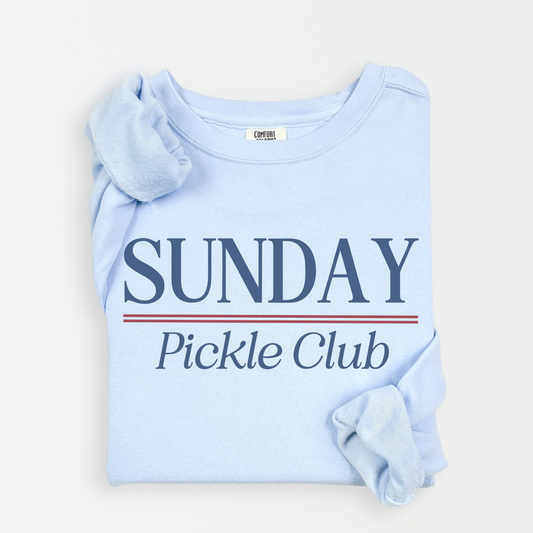 Sunday Pickle Club Comfort Colors lightweight crewneck sweatshirt with a vintage retro vibe, featuring bold red and blue print on soft cotton fabric, styled for casual or athletic wear.