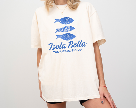 Comfort Colors short sleeve t-shirt with "Isola Bella" and a design of three boho-style fish, perfect for Italian travel and Sicily lovers.