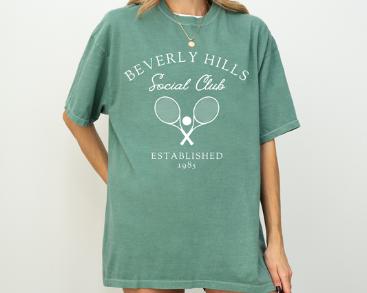 Comfort Colors short sleeve t-shirt featuring a vintage racquet tennis club design with Beverly Hills Social Club lettering, ideal for casual wear and old money vibes.