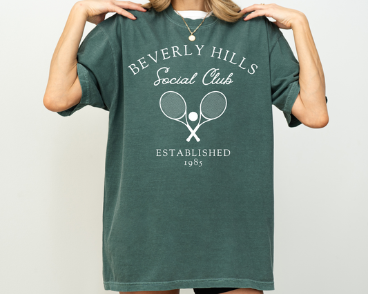 Comfort Colors short sleeve t-shirt featuring a vintage racquet tennis club design with Beverly Hills Social Club lettering, ideal for casual wear and old money vibes.