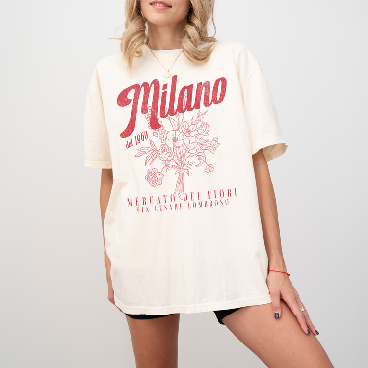 Comfort Colors short sleeve t-shirt with "Milano Mercato Dei Fiori" in a faded, vintage retro boho style, perfect for adding Italian market charm to any outfit.