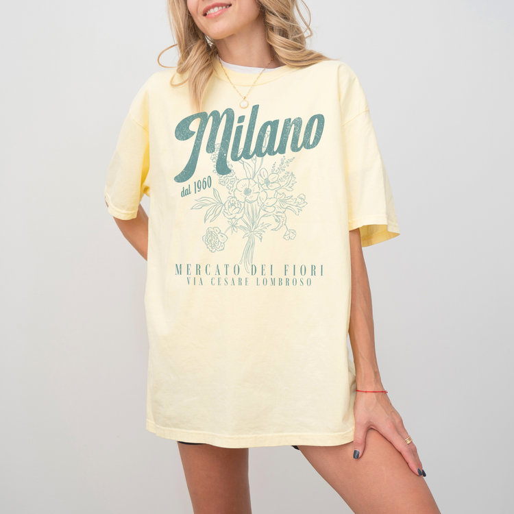 Comfort Colors short sleeve t-shirt with "Milano Mercato Dei Fiori" in a faded, vintage retro boho style, perfect for adding Italian market charm to any outfit.