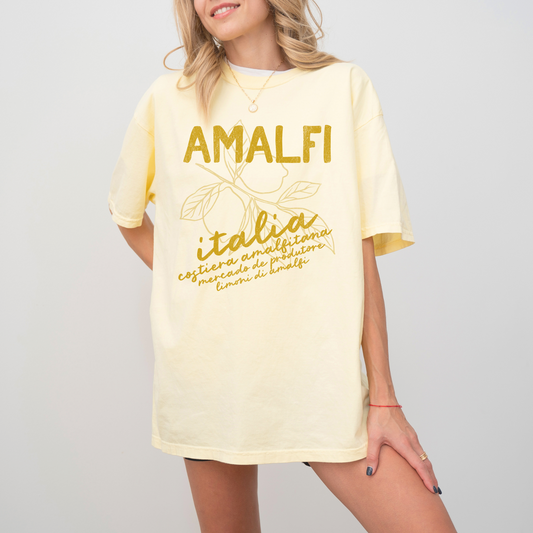 Comfort Colors t-shirt with "Amalfi, Italia" in boho style, featuring a vintage lemons design, inspired by the Amalfi Coast’s sunny charm.