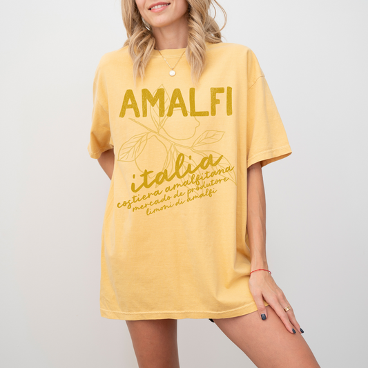 Comfort Colors t-shirt with "Amalfi, Italia" in boho style, featuring a vintage lemons design, inspired by the Amalfi Coast’s sunny charm.