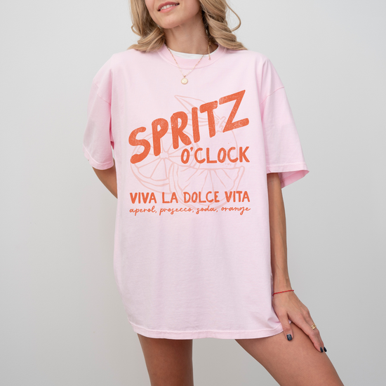 Comfort Colors short sleeve t-shirt with "Spritz O’Clock" in a faded, vintage retro style, perfect for Aperol and Campari lovers and casual, sunny afternoons.