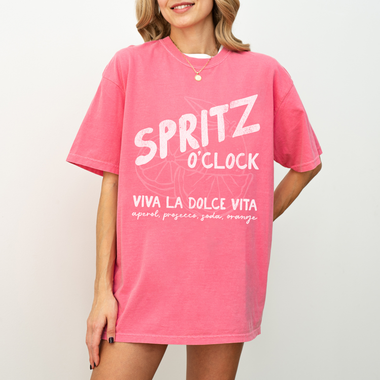 Comfort Colors short sleeve t-shirt with "Spritz O’Clock" in a faded, vintage retro style, perfect for Aperol and Campari lovers and casual, sunny afternoons.