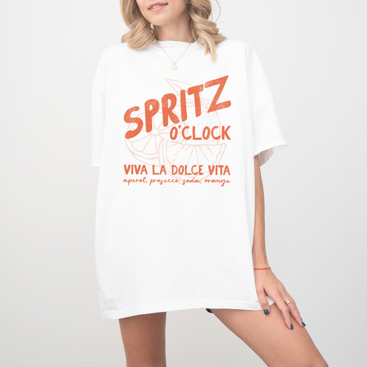 Comfort Colors short sleeve t-shirt with "Spritz O’Clock" in a faded, vintage retro style, perfect for Aperol and Campari lovers and casual, sunny afternoons.