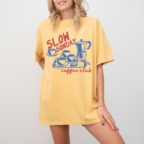 Comfort Colors short sleeve t-shirt with "Slow Sunday Coffee Club" in a faded, vintage boho style, featuring a traditional Italian moka pot for a cozy coffee lover’s look.