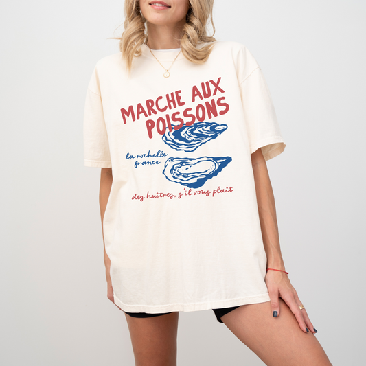 Comfort Colors short sleeve t-shirt with "Marché de Poisson" in a faded, vintage retro boho style, featuring oyster graphics for a French market-inspired look.