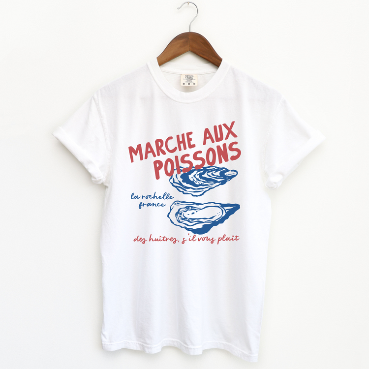 Comfort Colors short sleeve t-shirt with "Marché de Poisson" in a faded, vintage retro boho style, featuring oyster graphics for a French market-inspired look.