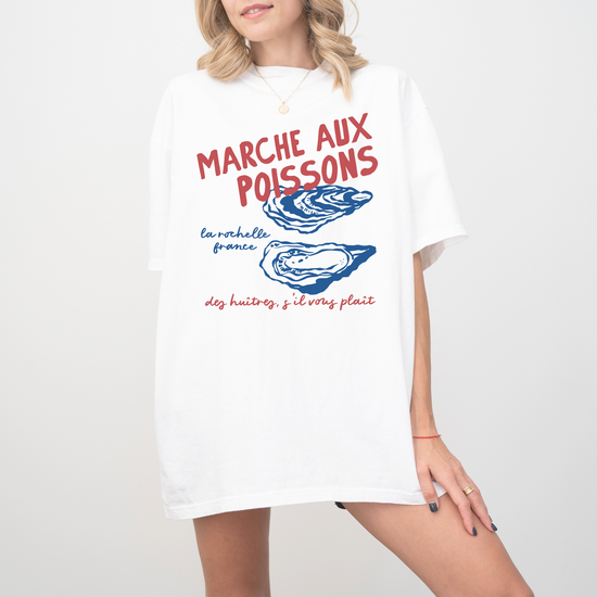 Comfort Colors short sleeve t-shirt with "Marché de Poisson" in a faded, vintage retro boho style, featuring oyster graphics for a French market-inspired look.