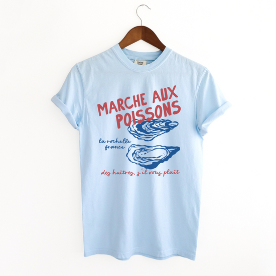 Comfort Colors short sleeve t-shirt with "Marché de Poisson" in a faded, vintage retro boho style, featuring oyster graphics for a French market-inspired look.