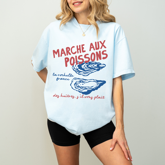 Comfort Colors short sleeve t-shirt with "Marché de Poisson" in a faded, vintage retro boho style, featuring oyster graphics for a French market-inspired look.