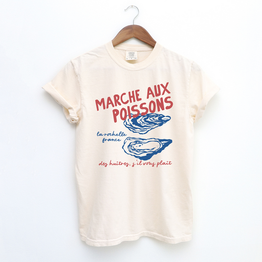 Comfort Colors short sleeve t-shirt with "Marché de Poisson" in a faded, vintage retro boho style, featuring oyster graphics for a French market-inspired look.