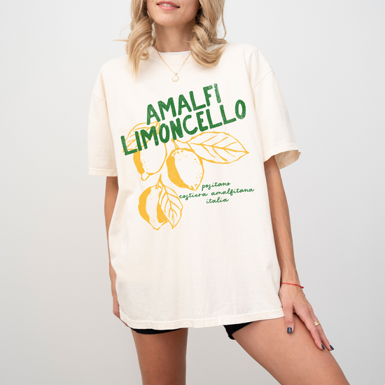 Comfort Colors short sleeve t-shirt with "Amalfi Limoncello" in vintage retro boho style, featuring faded lemon graphics for a grunge-inspired, Italian summer look.