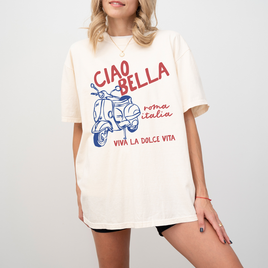 Comfort Colors short sleeve t-shirt with "Ciao Bella" and a Vespa graphic, featuring "Roma, Italia" in a vintage Italian style, perfect for casual wear and travel-inspired looks.