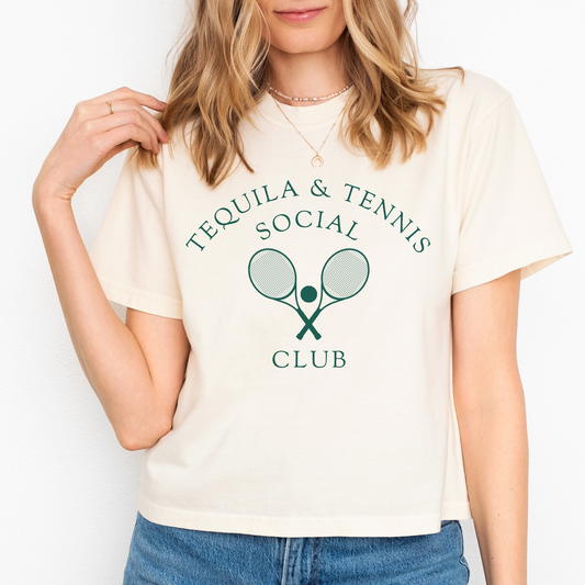 Women's boxy Comfort Colors tee with 'Tequila and Tennis Social Club' print. Vintage athletic aesthetic, relaxed fit, soft fabric. Perfect for casual, sporty style with a playful twist.