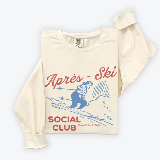 Lightweight crewneck sweatshirt with faded grunge look, vintage graphic of a woman skier, designed with retro après-ski style