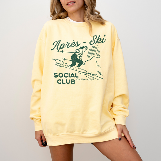 Lightweight crewneck sweatshirt with faded grunge look, vintage graphic of a woman skier, designed with retro après-ski style