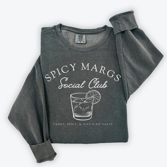 A Comfort Colors lightweight cotton crewneck sweatshirt with "Spicy Margs Social Club" printed in a fun, vintage retro style, ideal for girls' trips, bachelorette parties, or as a spirited gift.