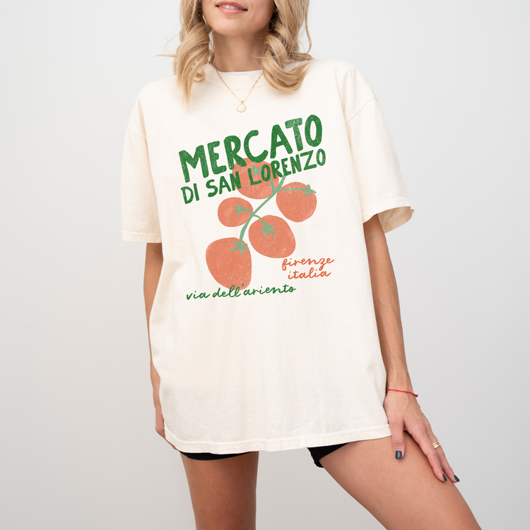 A Comfort Colors short sleeve t-shirt with "Mercato di San Lorenzo, Firenze Italia" and an illustration of tomatoes in a grunge, vintage retro style, inspired by Italian market culture.