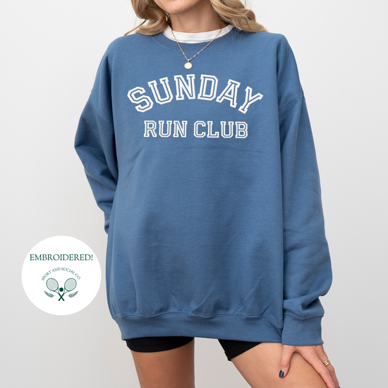 A sweatshirt with "Sunday Run Club" embroidered in bold white stitching across the front, approximately 10 inches wide. The design has a sporty, vintage-inspired look, ideal for casual athleisure wear or workouts.