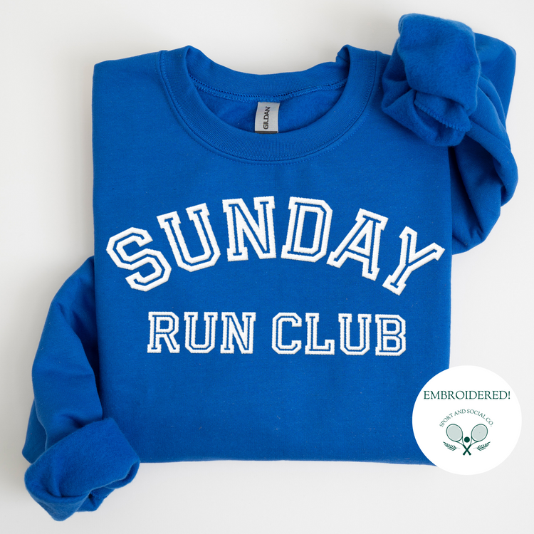 A sweatshirt with "Sunday Run Club" embroidered in bold white stitching across the front, approximately 10 inches wide. The design has a sporty, vintage-inspired look, ideal for casual athleisure wear or workouts.